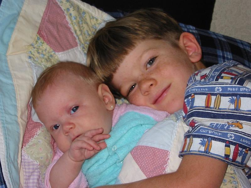 0-08.JPG - Kika with big brother Dave having some cuddle time.