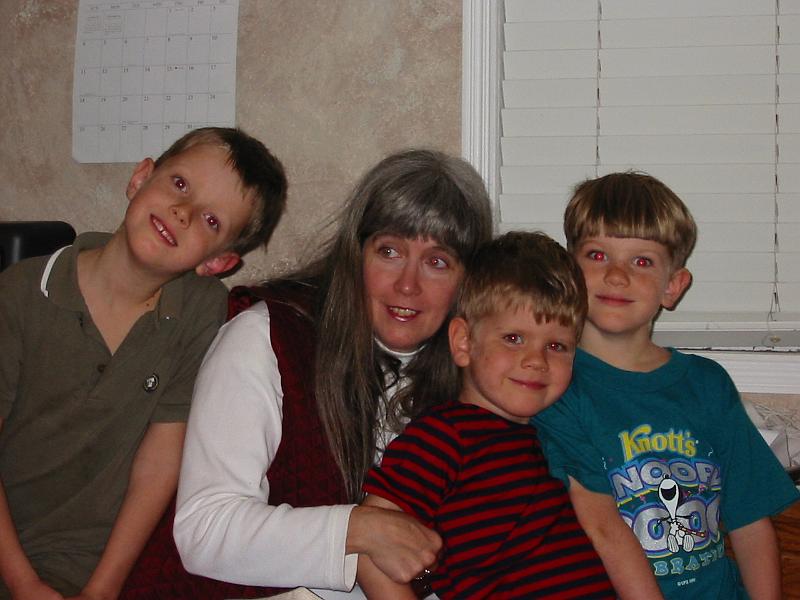 0-09.JPG - Our three oldest boys with Catherine, their sacrificial teacher and good friend. She later traveled to China as a missionary. However, shortly thereafter, she went to be with the Lord due to cancer. She was a wonderful example of love and dedication to all of us.