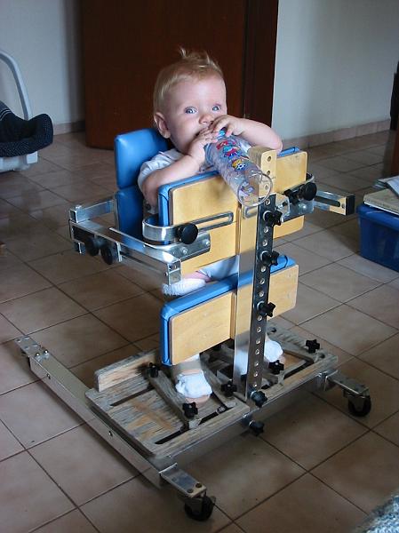 0-18.JPG - Another missionary, John, while on a trip to the states, received this "stander" as a donation. Kika was too small for it at the time, but she tried it out to see how it fit.