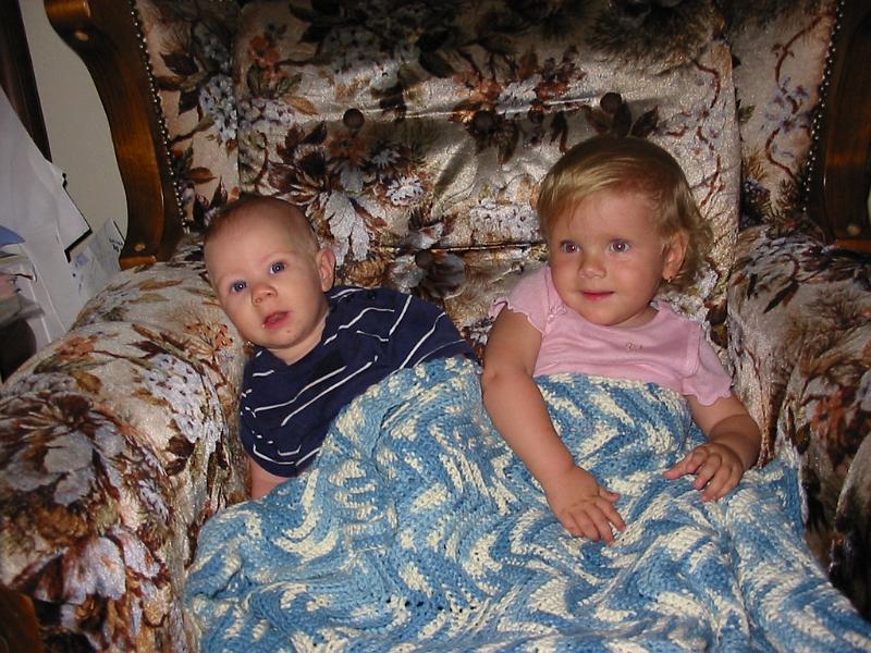 2-04.JPG - Visiting with her cousin, Kevin.