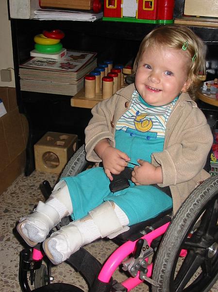 2-08.JPG - In front of some of Kika's school shelves with toys and educational equipment.