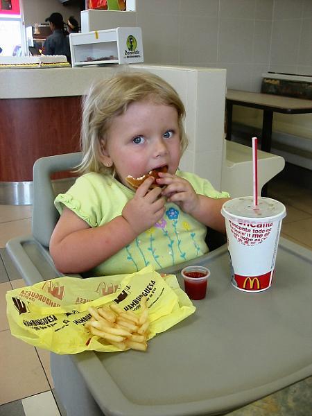 3-20.JPG - Eating at McDonalds. Kika had prayed for a cheeseburger and the manager donated enough for our whole family.